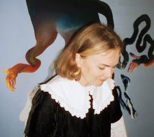 A winab standing in front of a painting