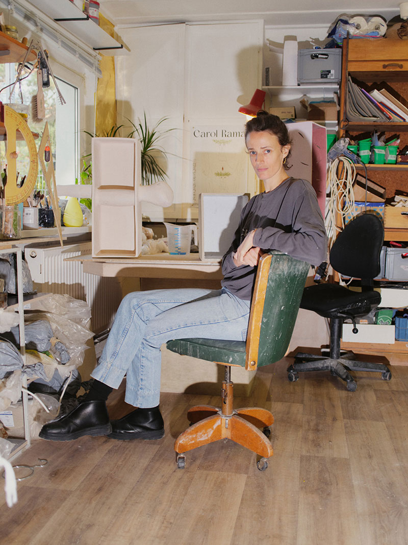 A woman sitting on a chair at a table