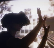 a photo of a person's silhouette wearing virtual reality goggles