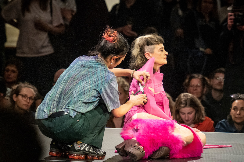 Performance of Yoko Ono's work 'Cut Piece' by Peaches in the Gropius Bau's atrium