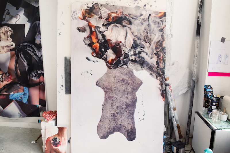 a detail photo of a painting in progress, hanging in the artists' studio