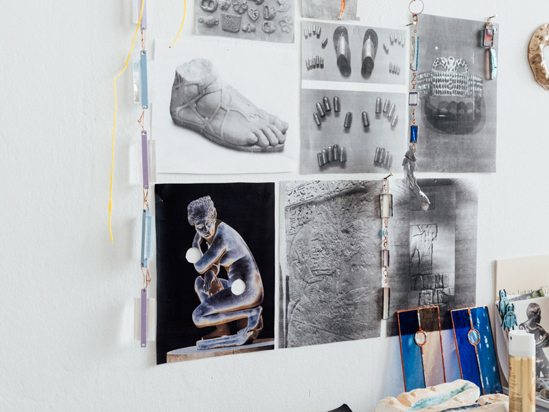 Photo of drawings mounted on a white wall