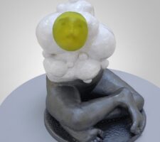 figure with silver crossed legs and a yellow face with white around